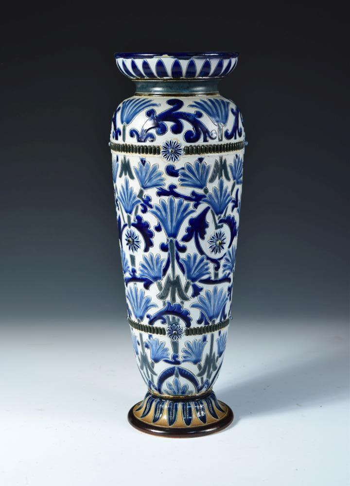 A Doulton Lambeth stoneware vase by Frank Butler, the tall slender form incised and painted in