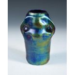 A Continental Art Nouveau Eosin glazed vase, possibly Zsolnay, the iridescent body with three