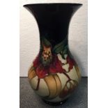 A large Moorcroft Anna Lily pattern vase, the baluster body with flared rim, painted and impressed