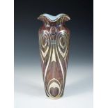 An Art Nouveau style iridescent glass vase with silver overlay, the slender form with flared rim,