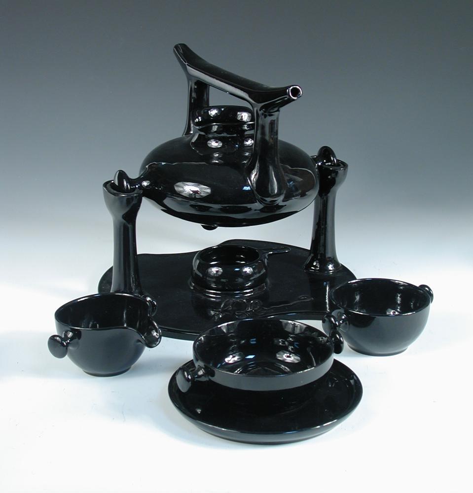 Luigi Colani for Friesland, Melitta, Germany, a black glazed 'Zen' tea service, designed 1973,