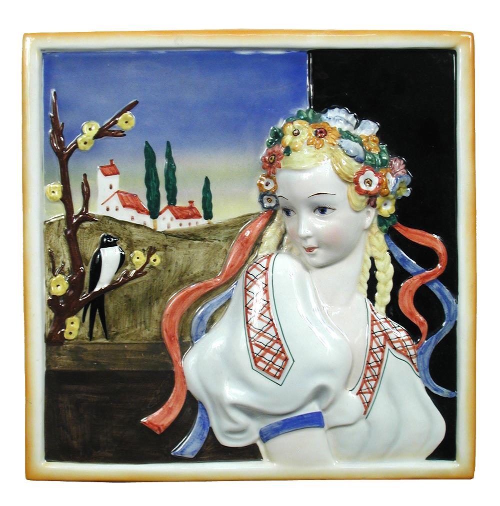 Attributed to Lenci, a porcelain plaque, decorated in relief with a maiden, a church behind and a