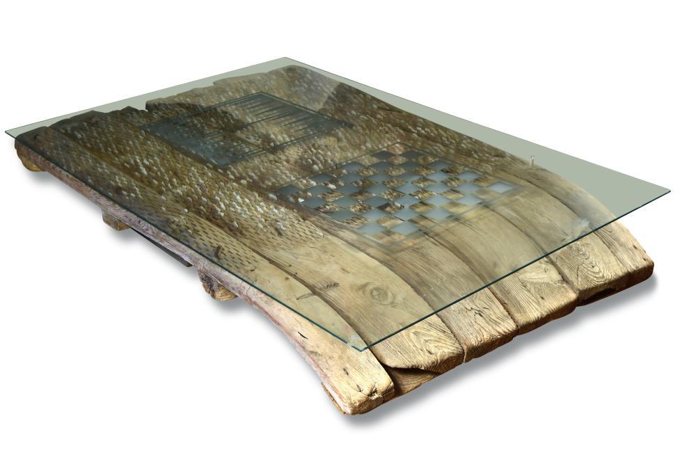 A 19th century threshing board, now mounted as a glass topped coffee table, the slatted frame