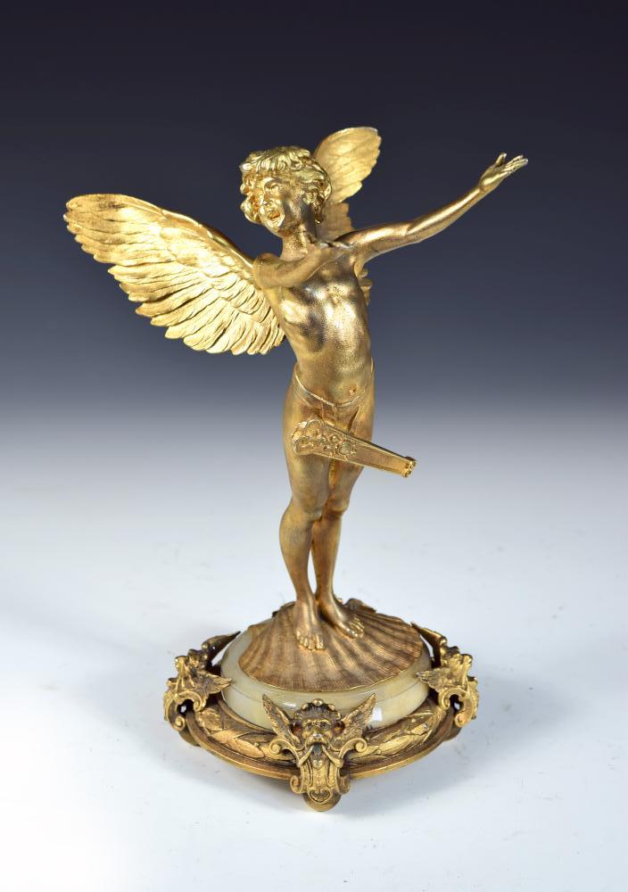 Franz von Stuck (German, 1863-1928) for WMF, a gilt metal figure of Cupid, modelled arms