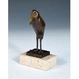 After Francois Pompon, (French, 1855-1933), a patinated bronze model of a stylised stork, mounted on