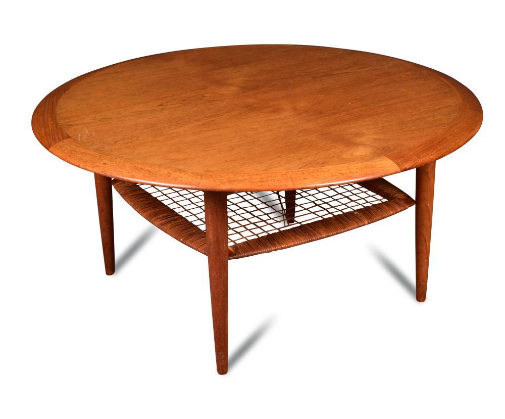 A Danish coffee table, possibly designed by Johannes Andersen, the circular top supported tapering