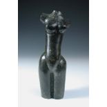 A 20th century carved stone female torso, the dark green stone model of the female nude signed