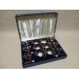 Cased Aynsley coffee set with blue ground with gilt leaf decoration and the silver spoons with