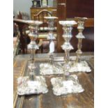 A set of four 18th century Old Sheffield plate candlesticks (one lacking sconce)