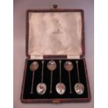 A set of six silver and enamel coffee spoons by Walker and Hall, cased