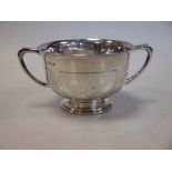 A small silver sugar basin