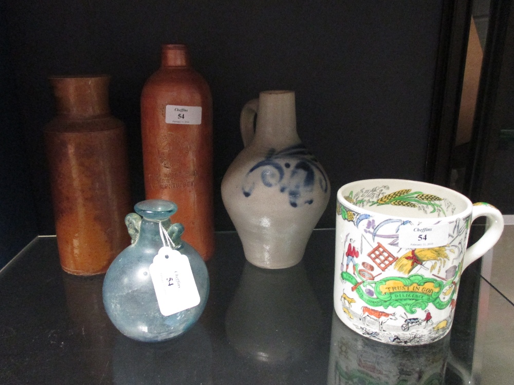 The Husbandsman Diligence Provides Bread' mug and other stoneware and a Roman style blue glass