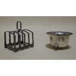 A silver toast rack and a sugar bowl