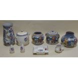 A collection of Poole pottery, including four early Carter, Stabler Adams pieces