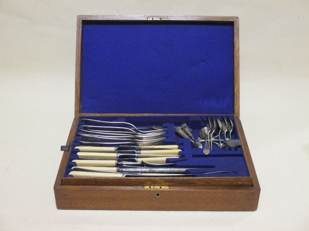 An oak canteen of cutlery