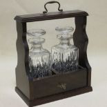 A 20th century mahogany two bottle decanter tantalus