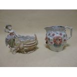 A Staffordshire devil's mask jug and a Plaue Art Nouveau figural bowl