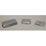 A silver cigar case and two silver cigarette cases