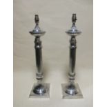 A pair of silver plated table lamps