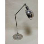 A modern nickel plated desk lamp