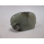 A Chinese jade pendant carved as an elephant