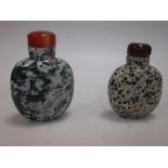 A 'Moss in Snow' snuff bottle and another in speckled stone