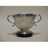 A silver two handled bowl