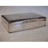 An early 20th century large silver cigarette box of rectangular shape, 23cm wide stamped 925