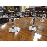 A pair of Old Sheffield plate three light candelabra