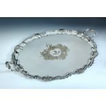 A very large early Victorian electroplate two handled tray, of oval shape with shell scrolled