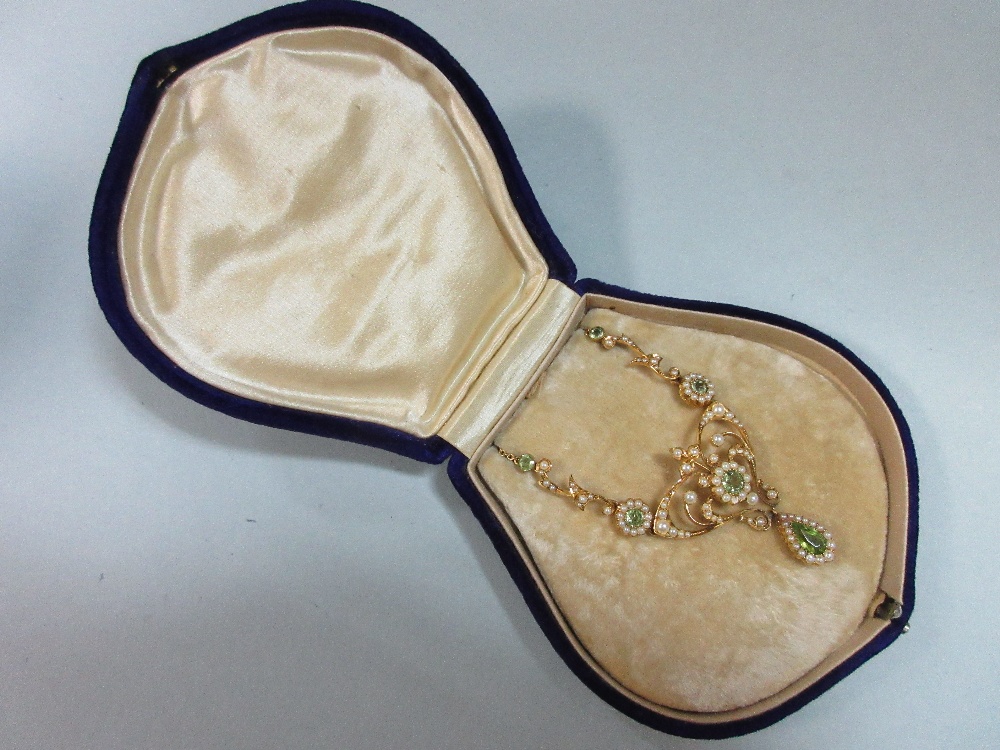 An Edwardian peridot and pearl necklace, the central art nouveau style motif set with a round cut - Image 6 of 7