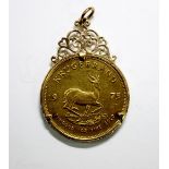 South Africa - A gold Kruger Rand coin, 1975, contained in a 9ct gold pendant mount, gross weight