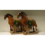 A pair of Chinese sangcai horses, modelled in the Tang taste, the green saddle cloths contrasting