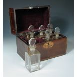 A Regency mahogany decanter box, the rectangular box inlaid with shell paterae and chequer