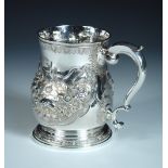 A George II silver pint beer mug, by William Williams I, London 1743, the baluster body later chased