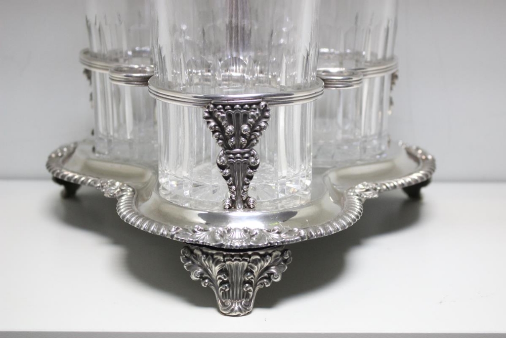 An early Victorian Old Sheffield plate three bottle decanter stand, the trefoil base having three - Image 2 of 4