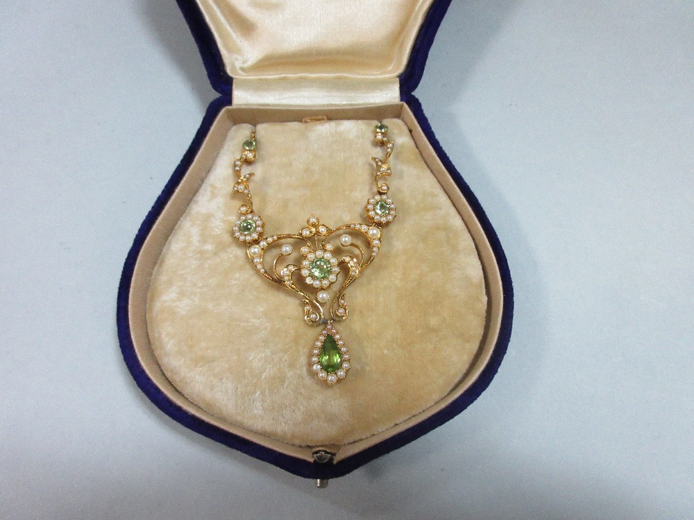 An Edwardian peridot and pearl necklace, the central art nouveau style motif set with a round cut - Image 7 of 7