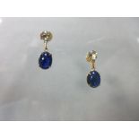 A pair of aquamarine and sapphire earrings, each post headed by a round cut aquamarine suspending an