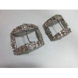 A pair of Regency paste set shoe buckles, set throughout with white round and geometrically shaped