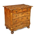 A small 19th century Dutch marquetry chest, with shaped outline top, inlaid with an urn and