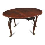 A George II mahogany oval drop leaf supper table, on cabriole legs and hoof shaped feet 70 x 114 x