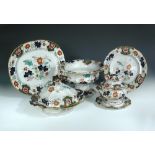 A mid 19th century Ironstone dinner service, probably Ridgways, each piece printed and painted