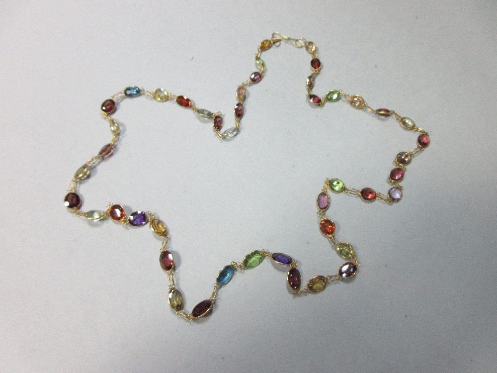 A multi-gemset chain necklace, spectacle set all along with graduated oval and round cut stones,