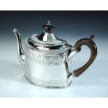 A George III silver teapot, by Peter and Ann Bateman, London 1799, the oval body with two bands of