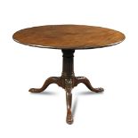 A George II mahogany pedestal table, the circular tilt top, on a birdcage support, fluted column and