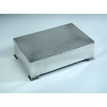 A large silver cigarette/cigar box, by Mappin and Webb, Birmingham 1929, of rectangular shape raised