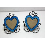 A pair of late Victorian silver and blue enamel heart shaped photograph frames, by Gourdel Vales &