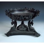 A large Regency style bronze tazza, the glazed earthenware bowl supported by three patinated