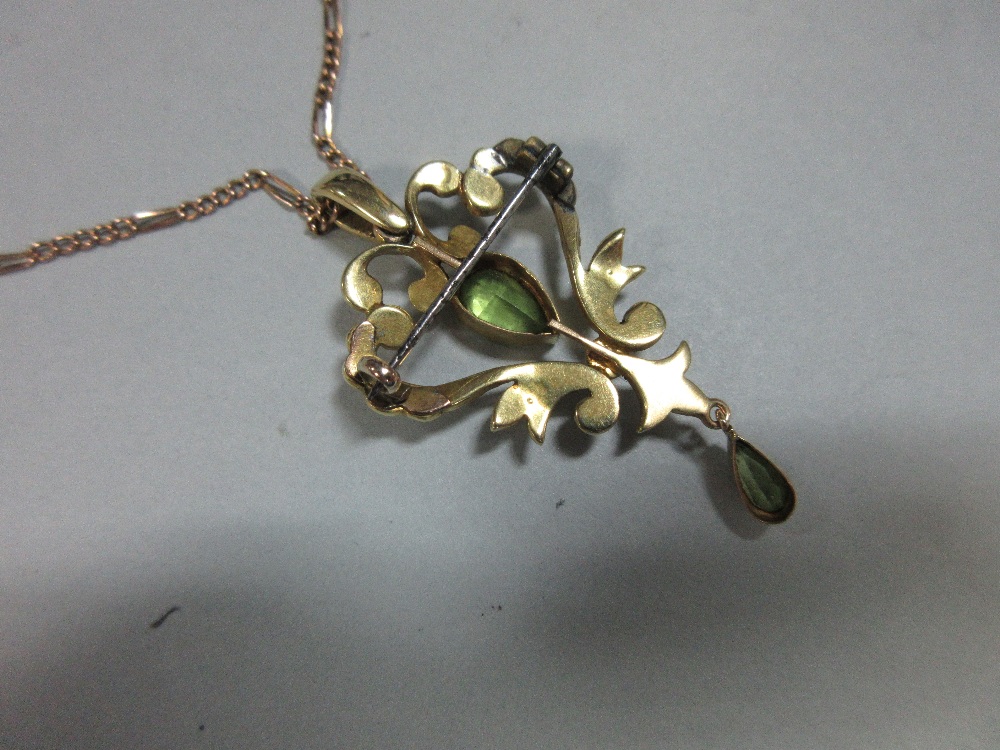 An Edwardian peridot and seed pearl pendant/brooch with chain, the open heart-shaped pendant with - Image 3 of 3