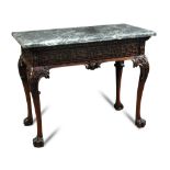A George II style Irish mahogany console table, with grey green marble top, the frieze carved with